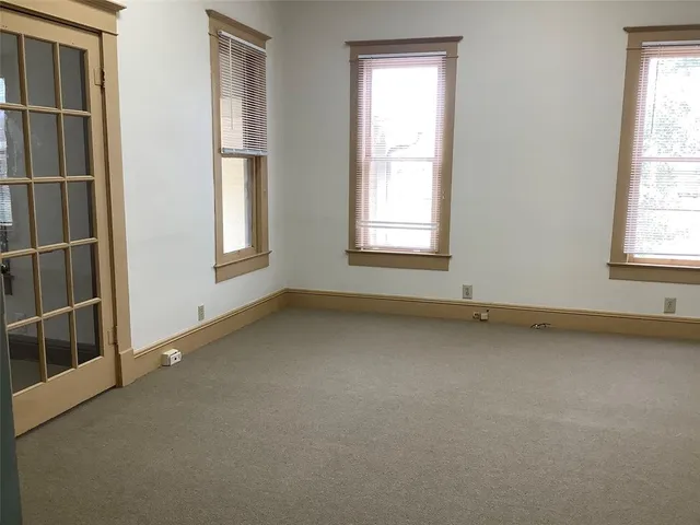 an empty room with windows