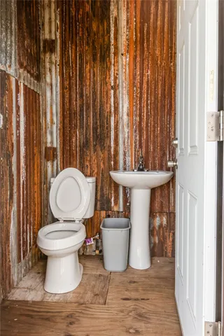 a bathroom with a toilet and a sink