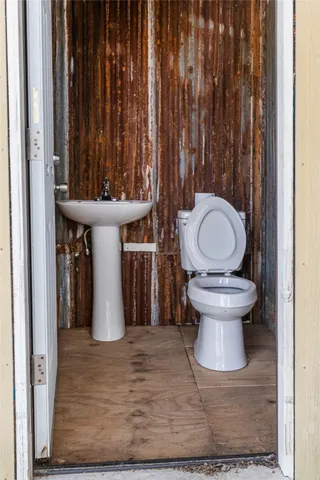 a bathroom with a toilet and a sink