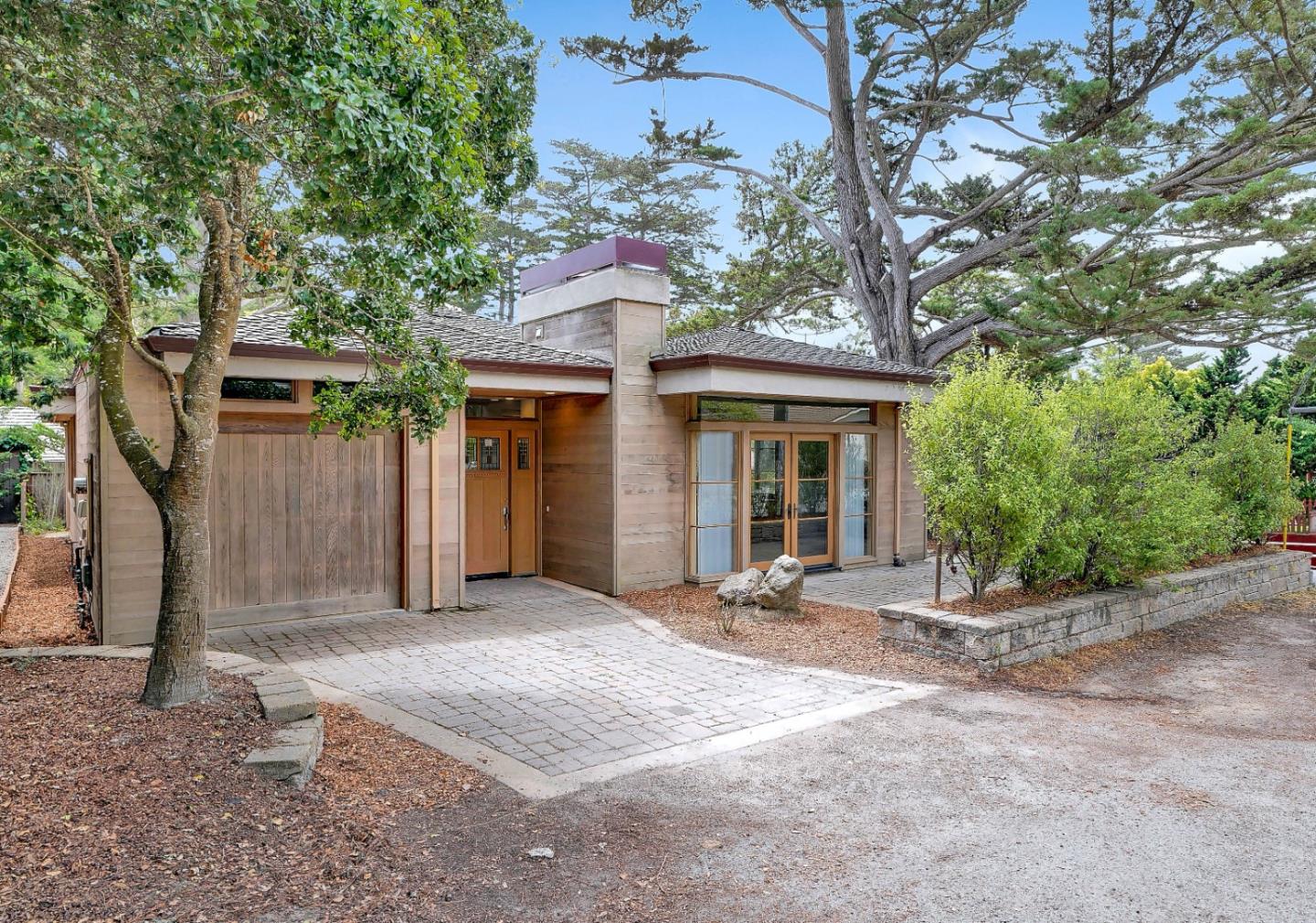 Se Corner Se Corner Carmel, CA 93923 - Photo 1 of 35 a front view of a house with a garden