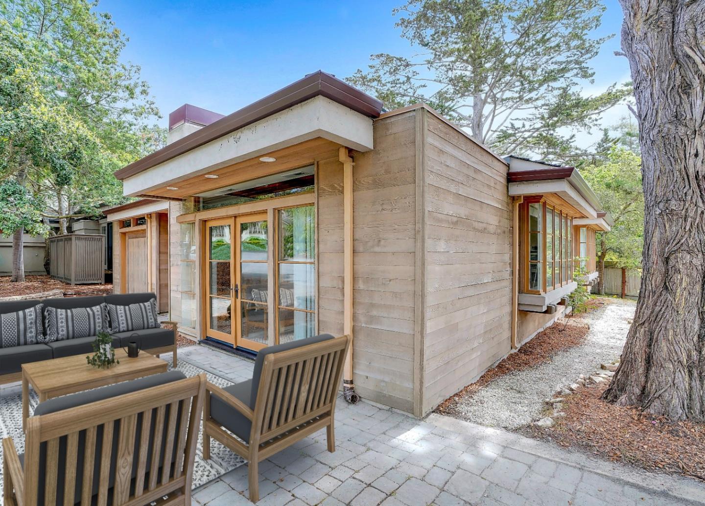 Se Corner Se Corner Carmel, CA 93923 - Photo 13 of 35 a view of a house with a small deck and a large tree