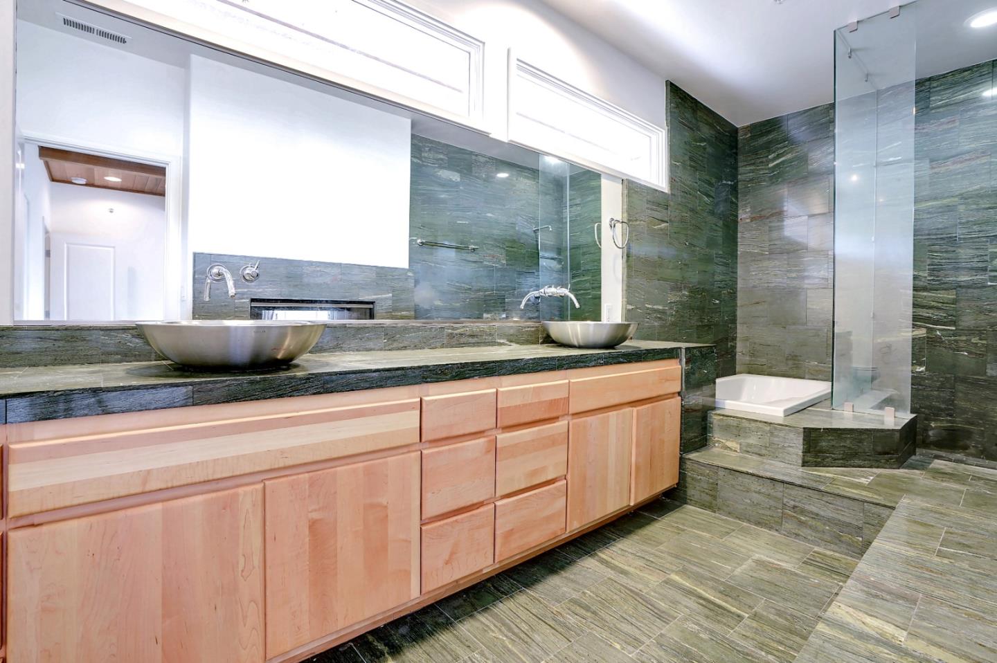 Se Corner Se Corner Carmel, CA 93923 - Photo 28 of 35 a bathroom with a double vanity sink and a mirror