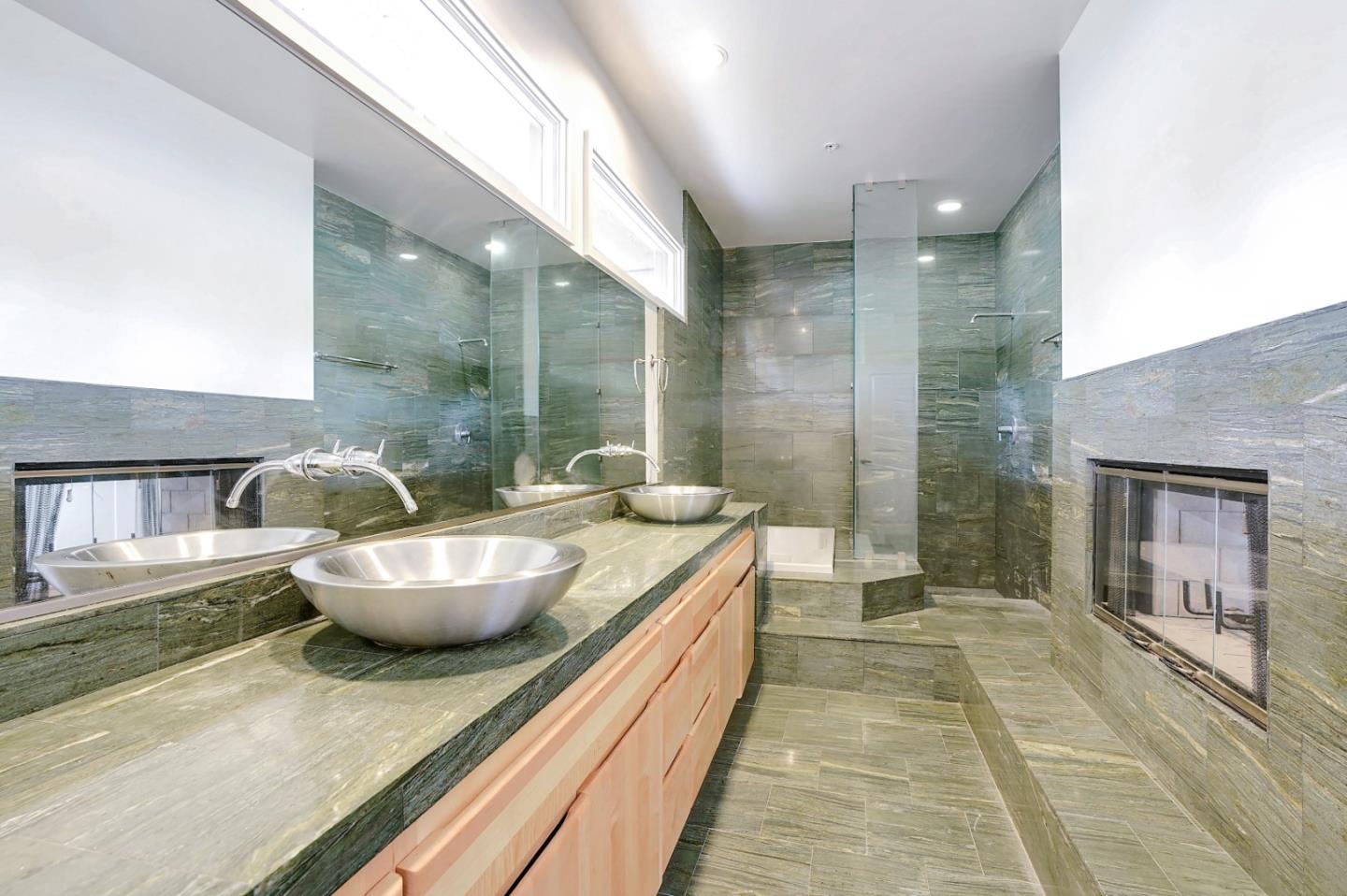 Se Corner Se Corner Carmel, CA 93923 - Photo 29 of 35 a bathroom with a granite countertop sink and a mirror