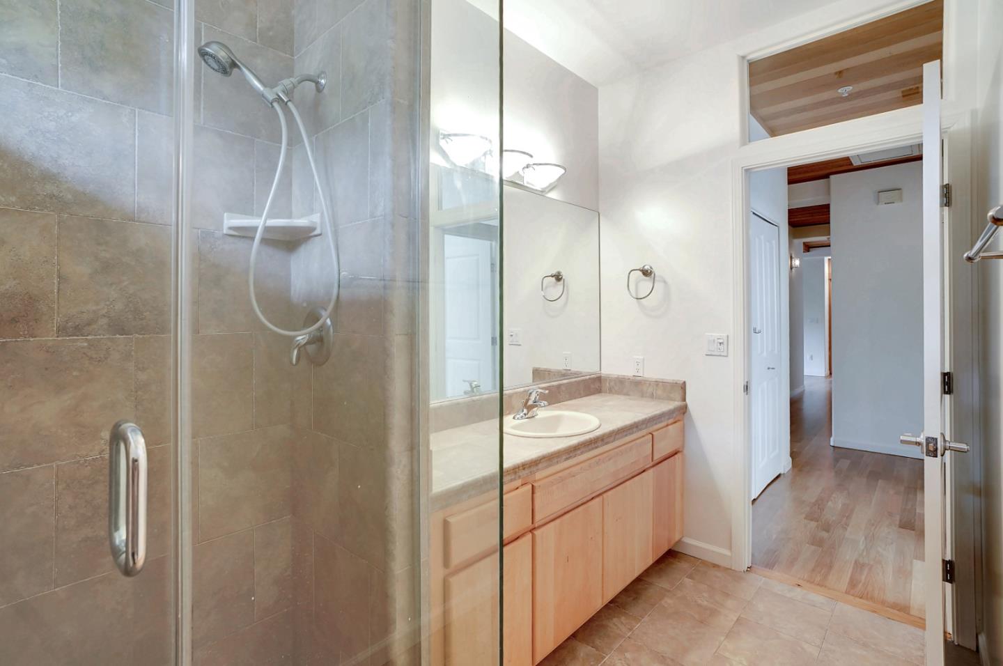 Se Corner Se Corner Carmel, CA 93923 - Photo 32 of 35 a spacious bathroom with a granite countertop sink mirror and shower