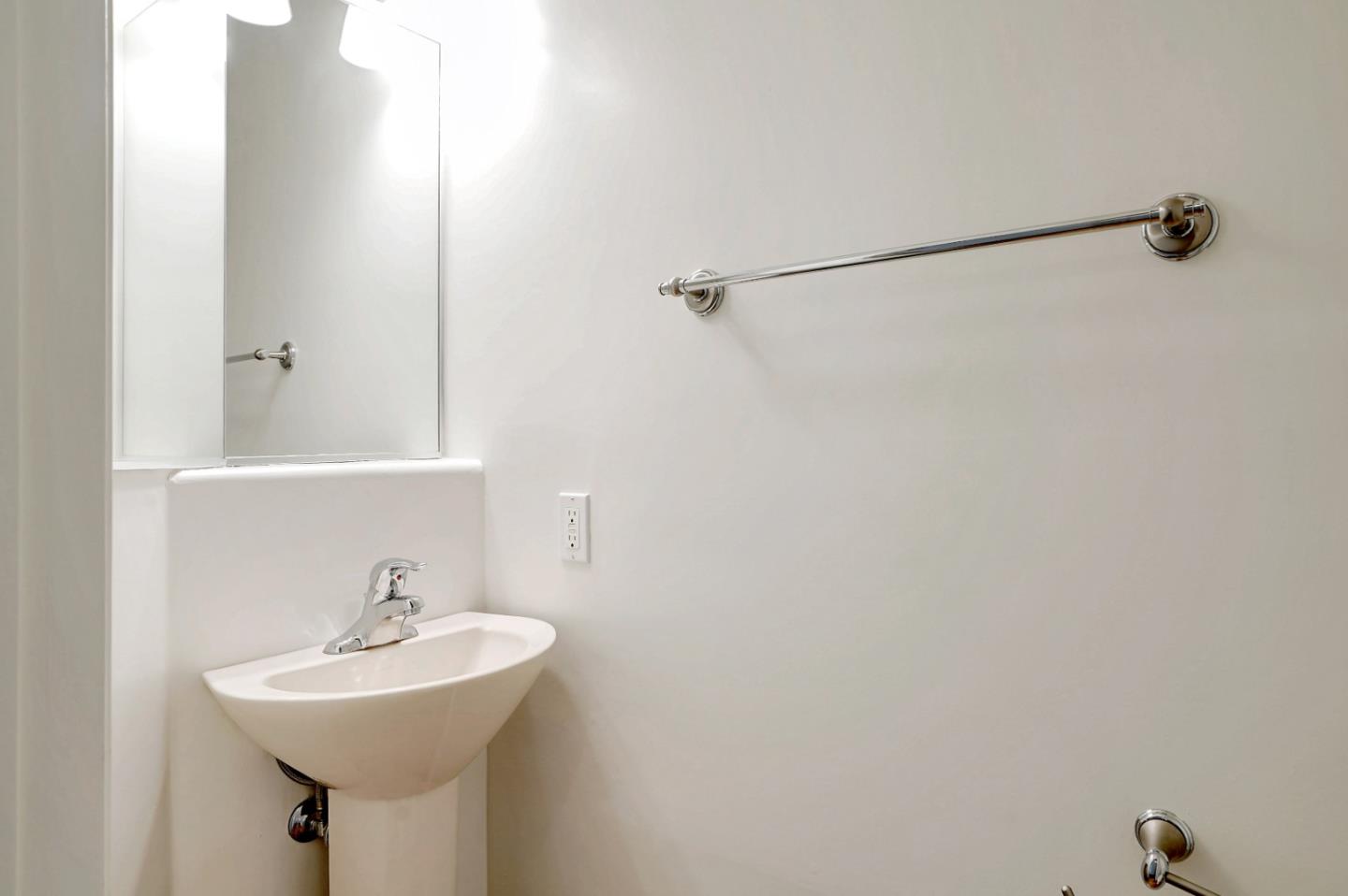 Se Corner Se Corner Carmel, CA 93923 - Photo 33 of 35 a bathroom with a sink a mirror and a shower