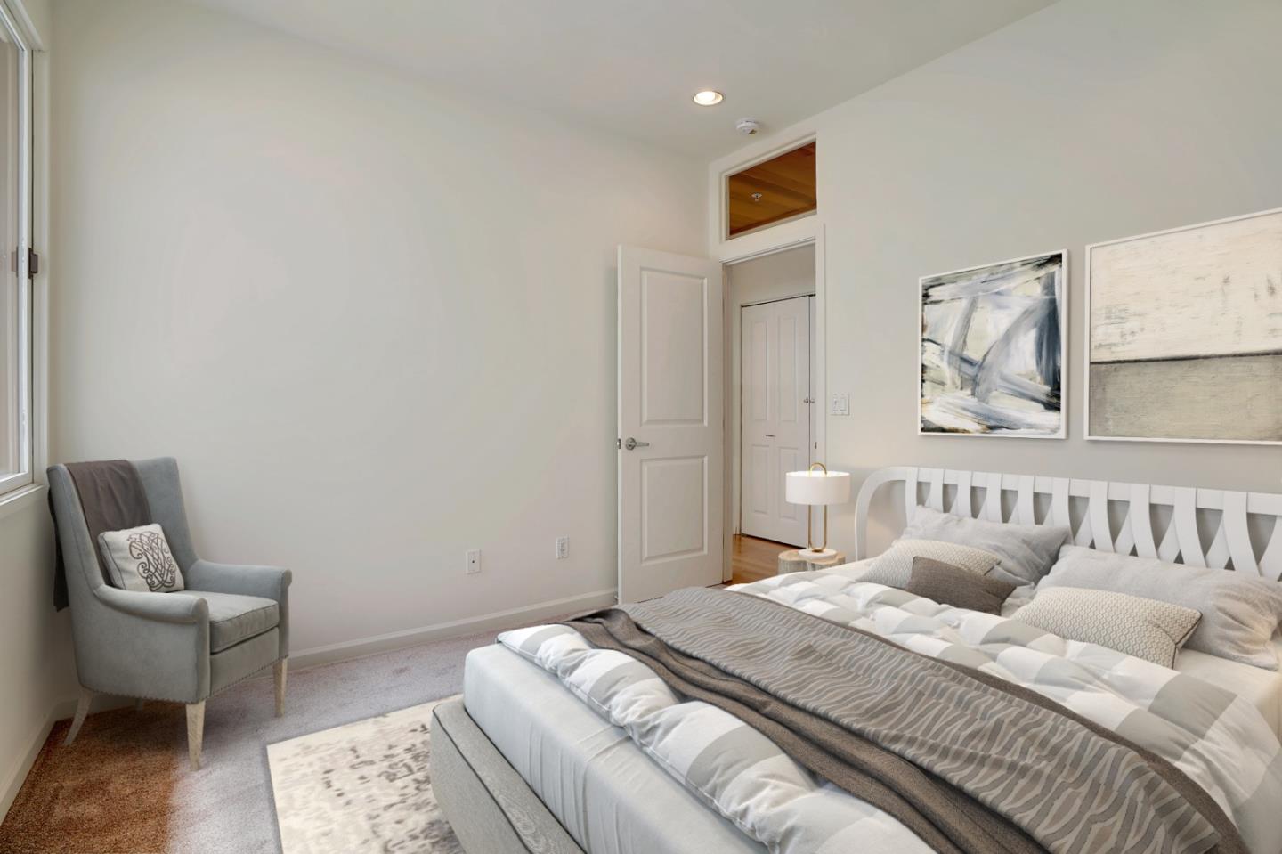 Se Corner Se Corner Carmel, CA 93923 - Photo 9 of 35 a bedroom with a bed and chair