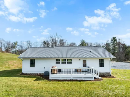 a front view of house with yard outdoor seating and barbeque oven