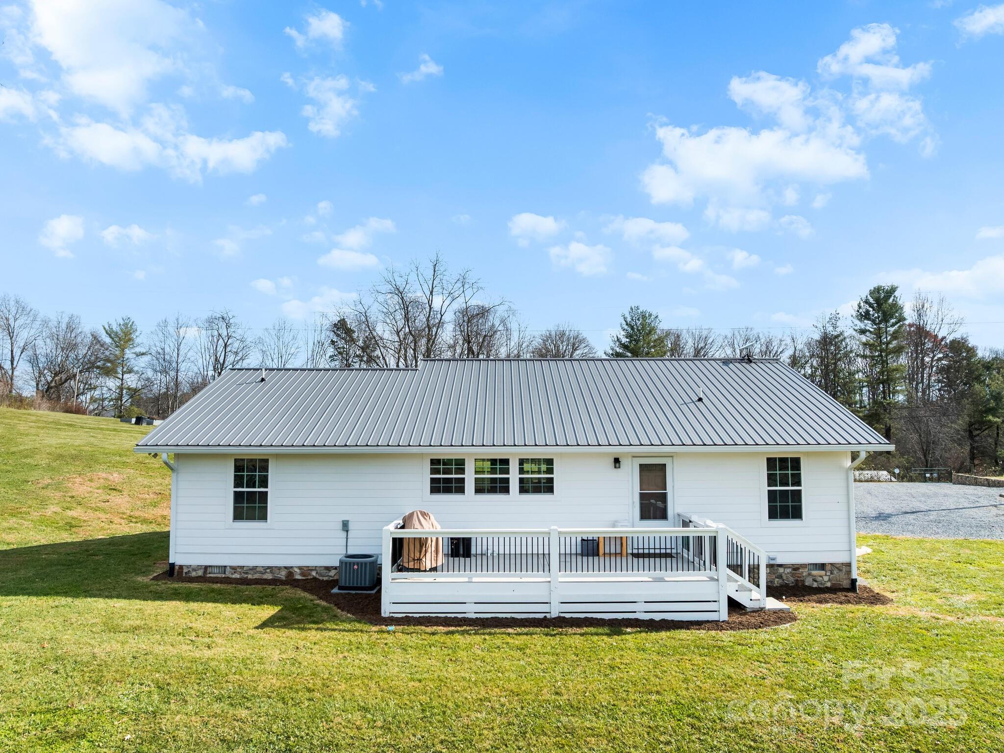 3367 Thickety Road Clyde, NC 28721 - Photo 18 of 21 a front view of house with yard outdoor seating and barbeque oven