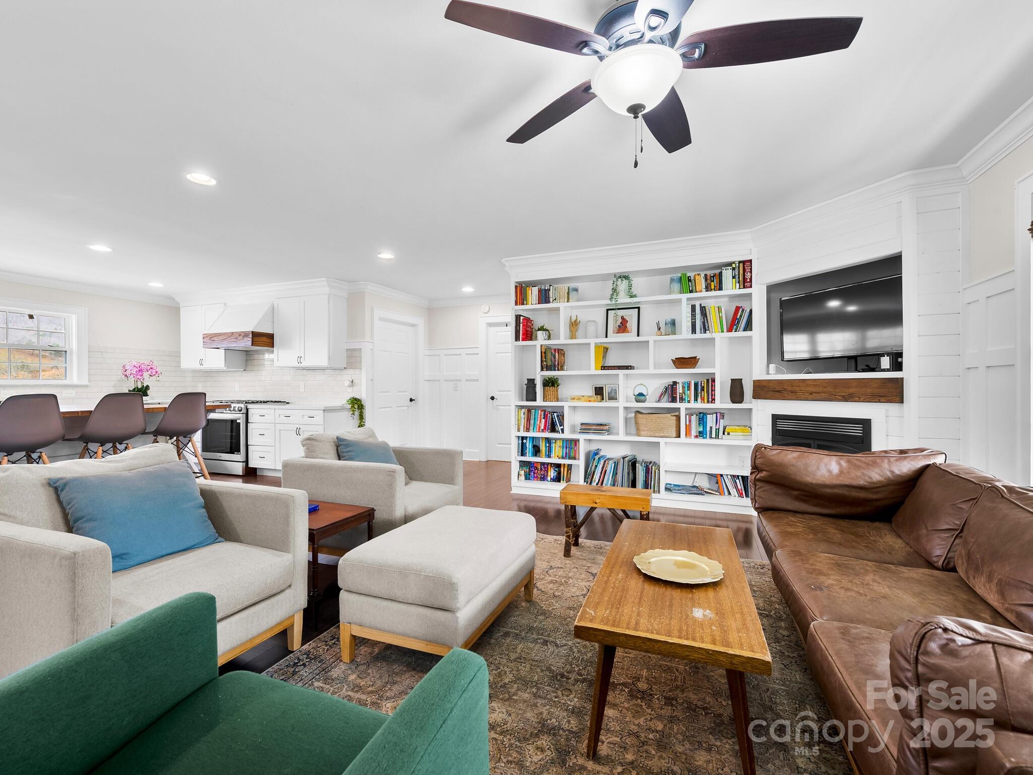 3367 Thickety Road Clyde, NC 28721 - Photo 4 of 21 a living room with furniture a rug and a flat screen tv