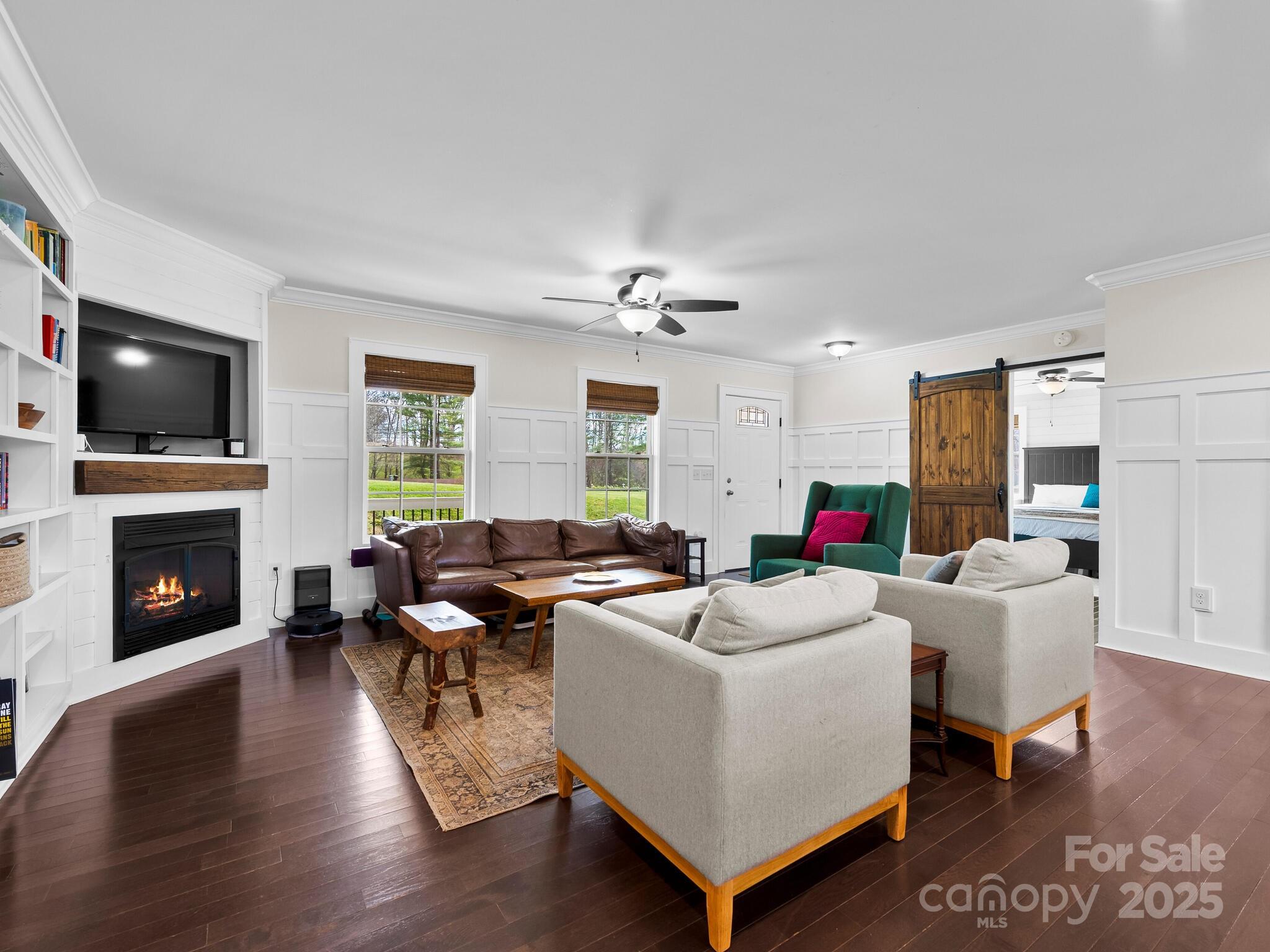 3367 Thickety Road Clyde, NC 28721 - Photo 6 of 21 a living room with fireplace furniture and a flat screen tv