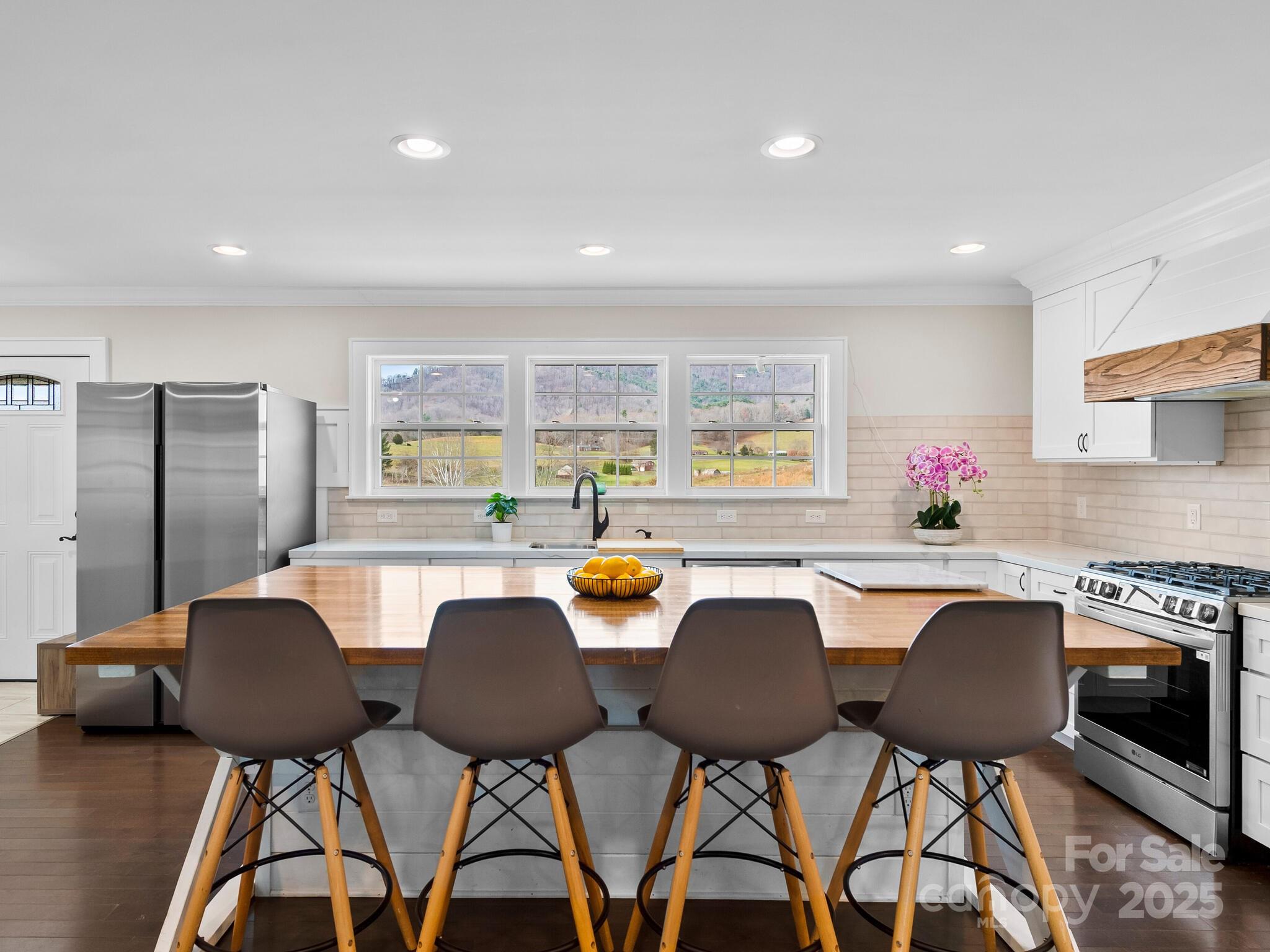 3367 Thickety Road Clyde, NC 28721 - Photo 7 of 21 a view of a dining room with furniture and a potted plant