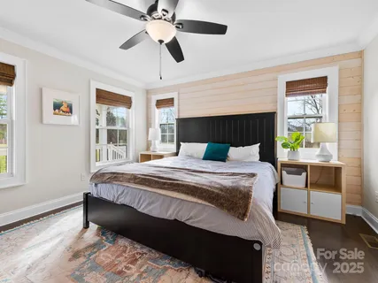 a bedroom with a bed lamps and window