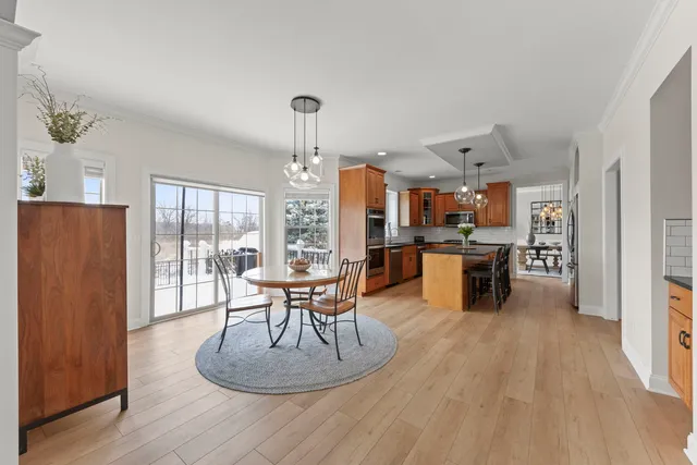 a kitchen with a table and chairs