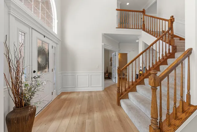 a view of staircase with wooden floor and a potted plant