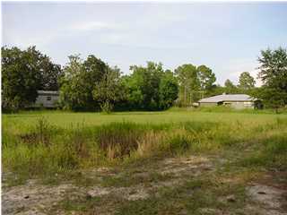 13 South 7th Street Santa Rosa Beach, FL 32459 - Photo 1 of 2 a view of a lake with houses in the background