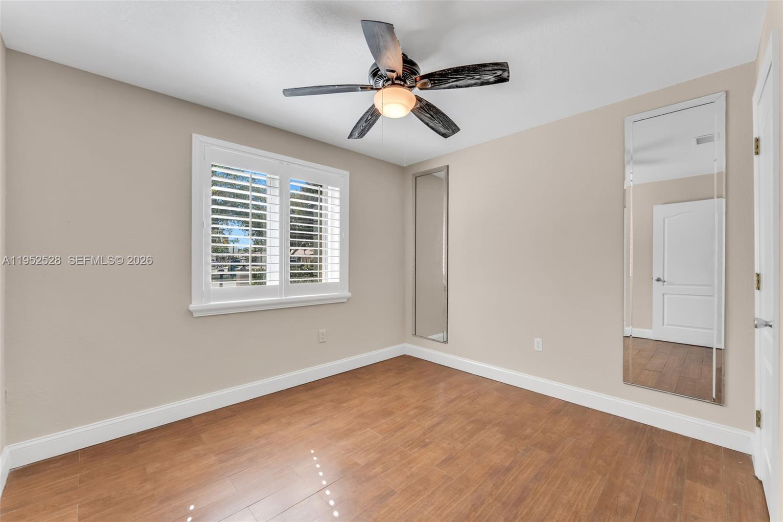 9567 Southwest 59th Terrace Miami, FL 33173 - Photo 14 of 36 a view of an empty room with a window