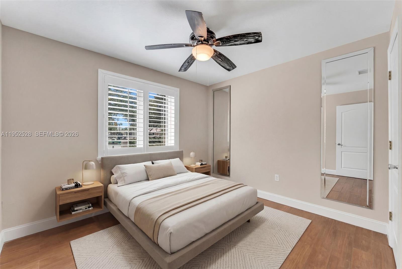 9567 Southwest 59th Terrace Miami, FL 33173 - Photo 15 of 36 a bedroom with a bed and a window