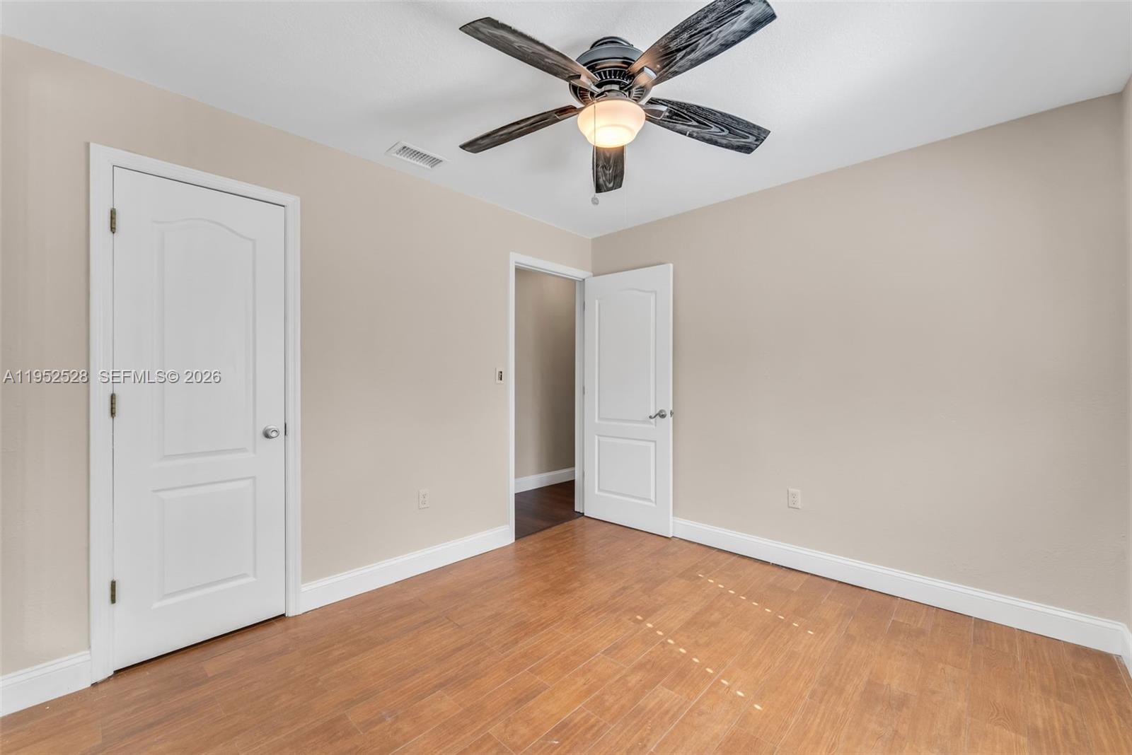 9567 Southwest 59th Terrace Miami, FL 33173 - Photo 16 of 36 an empty room with fan