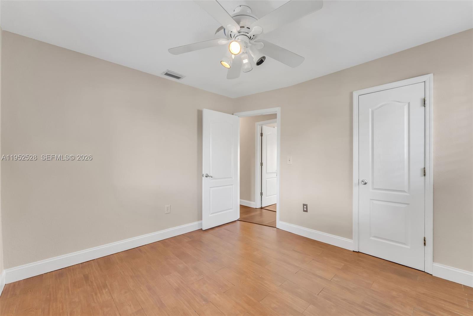 9567 Southwest 59th Terrace Miami, FL 33173 - Photo 20 of 36 a view of an empty room and chandelier fan