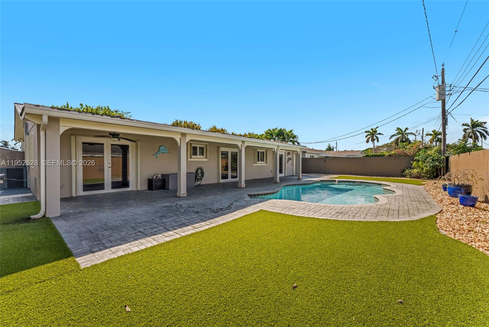 9567 Southwest 59th Terrace Miami, FL 33173 - Photo 28 of 36 a view of a house with swimming pool and sitting area