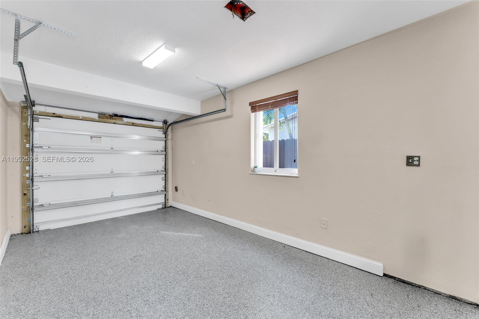 9567 Southwest 59th Terrace Miami, FL 33173 - Photo 30 of 36 an empty room with a window