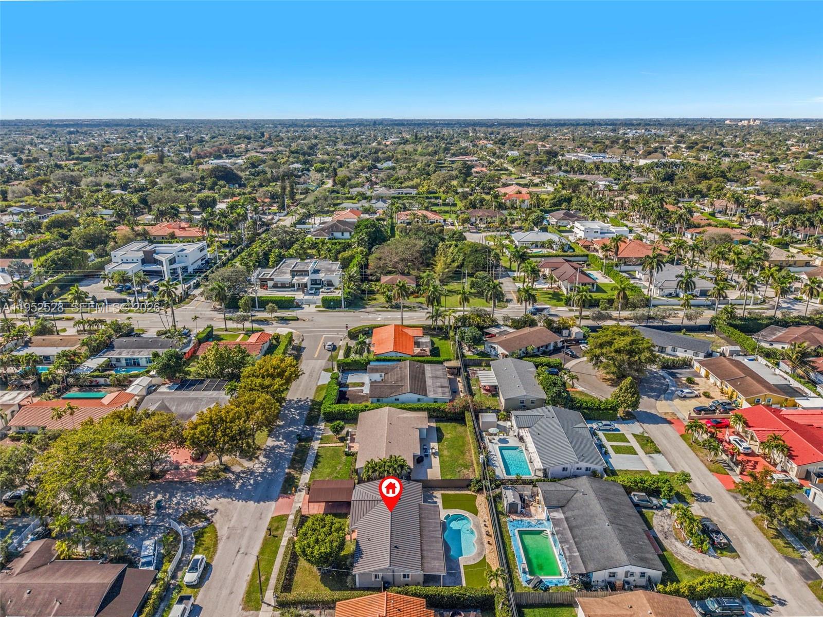 9567 Southwest 59th Terrace Miami, FL 33173 - Photo 34 of 36 an aerial view of residential houses with outdoor space and swimming pool