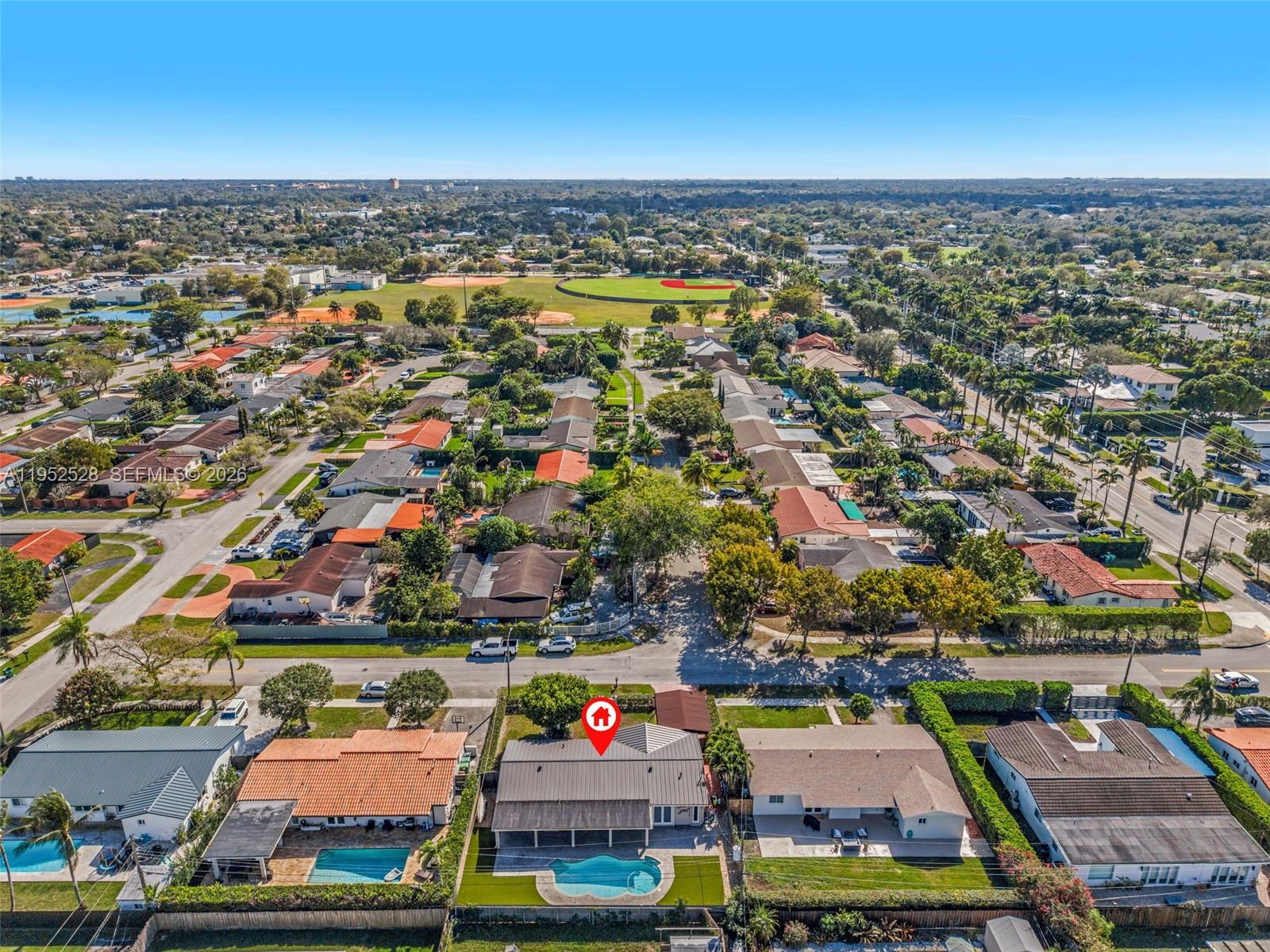9567 Southwest 59th Terrace Miami, FL 33173 - Photo 35 of 36 an aerial view of residential houses with outdoor space
