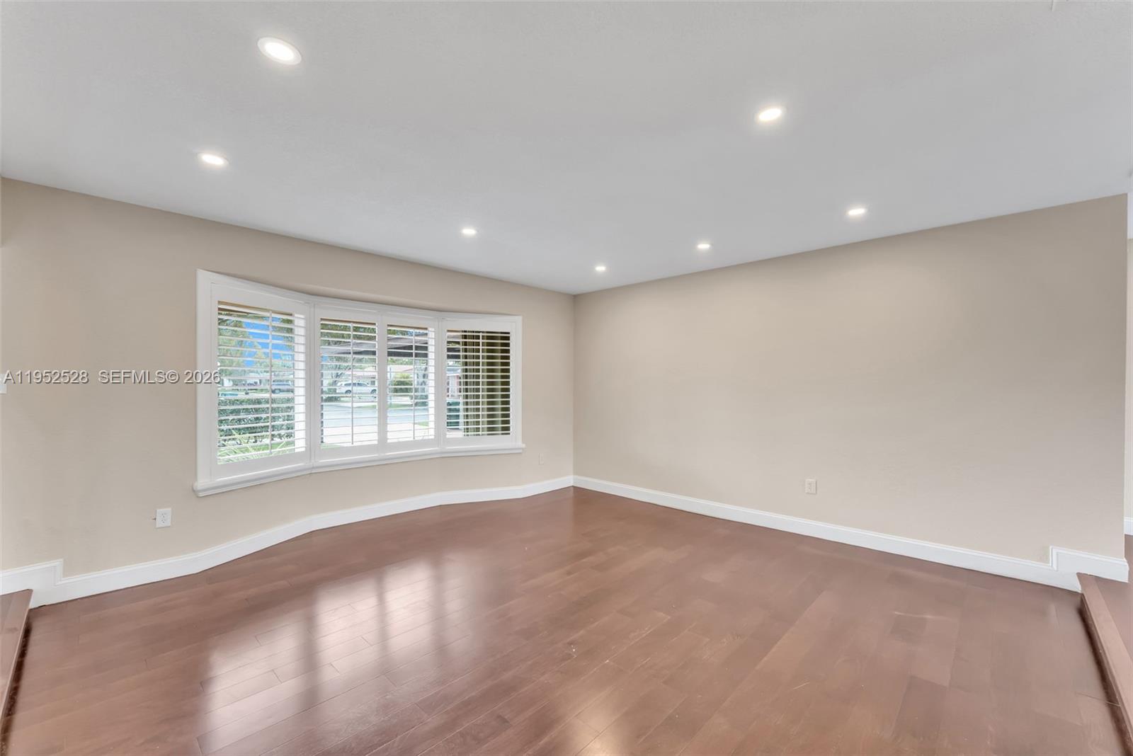 9567 Southwest 59th Terrace Miami, FL 33173 - Photo 8 of 36 a view of an empty room with a window