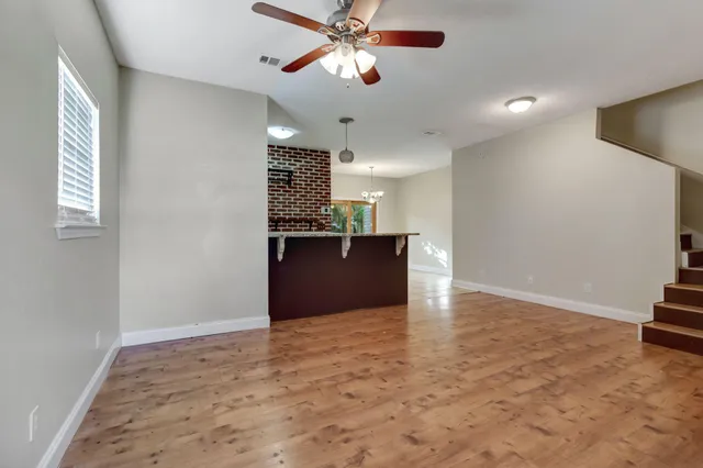 a view of a kitchen with a sink and a window