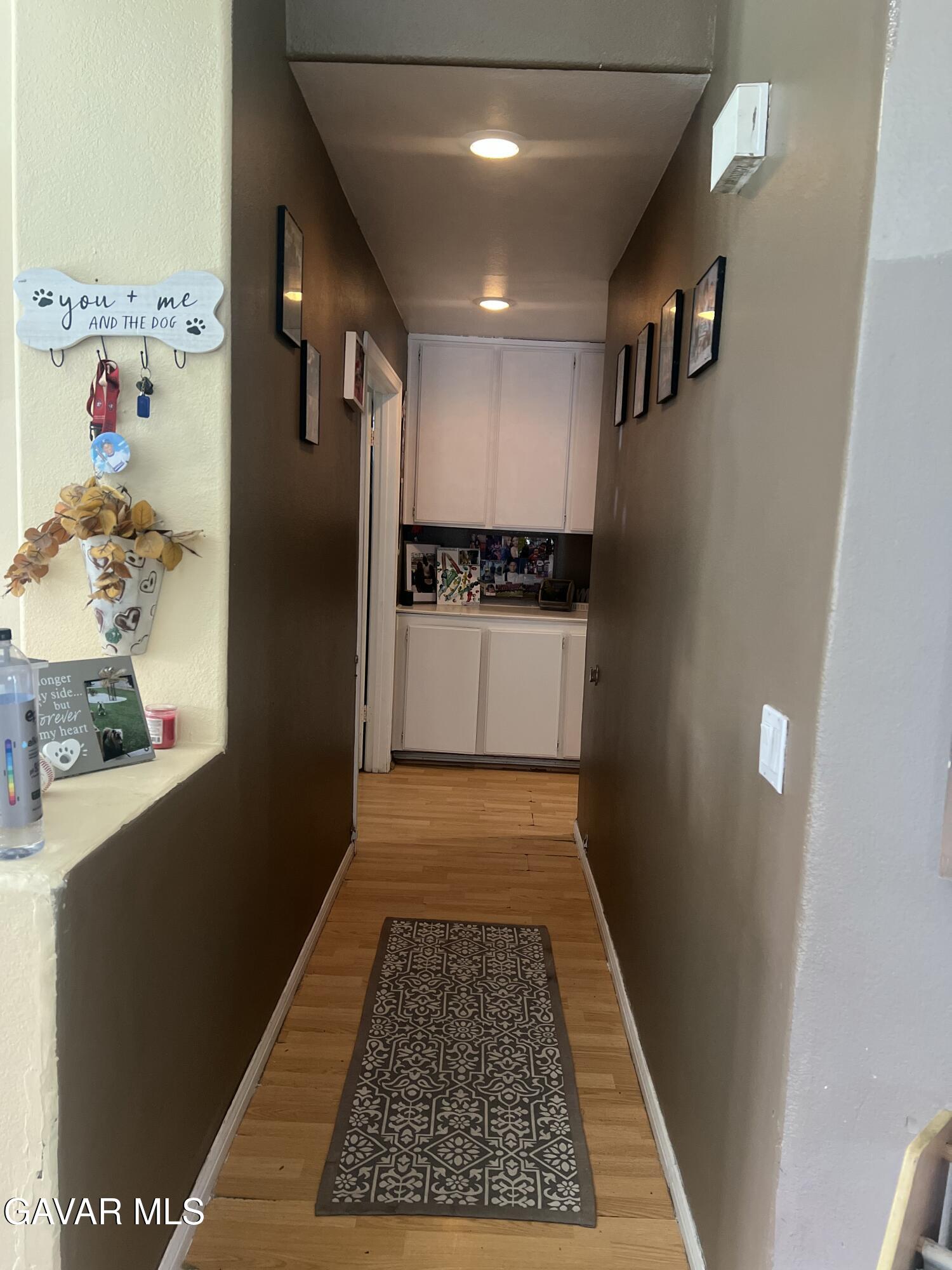 2428 Dixie Street Rosamond, CA 93560 - Photo 15 of 29 a view of hallway with a rug and a floor to ceiling window