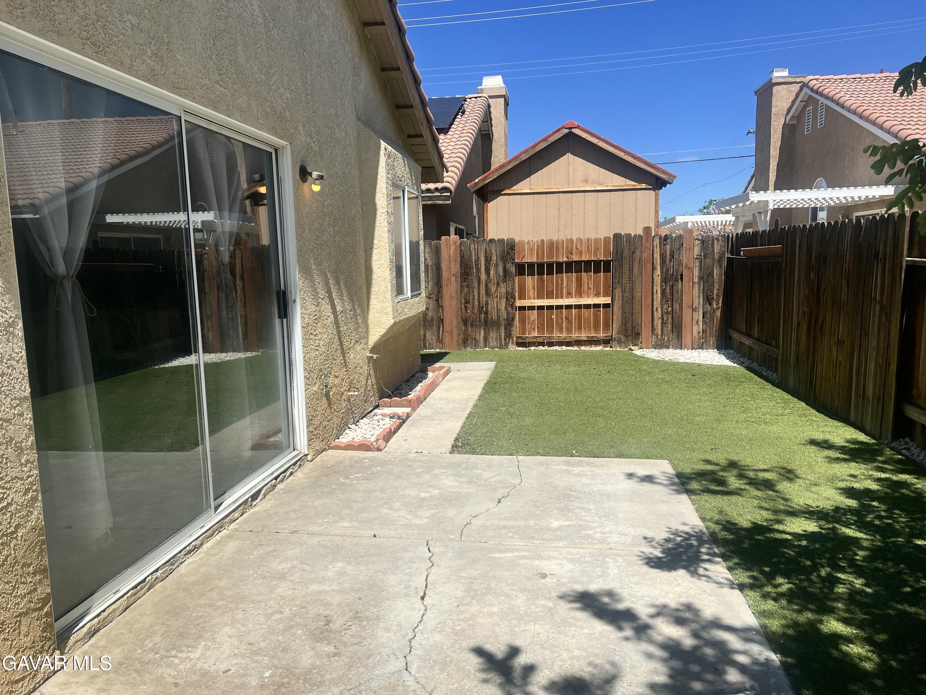 2428 Dixie Street Rosamond, CA 93560 - Photo 23 of 29 a view of a house with a porch