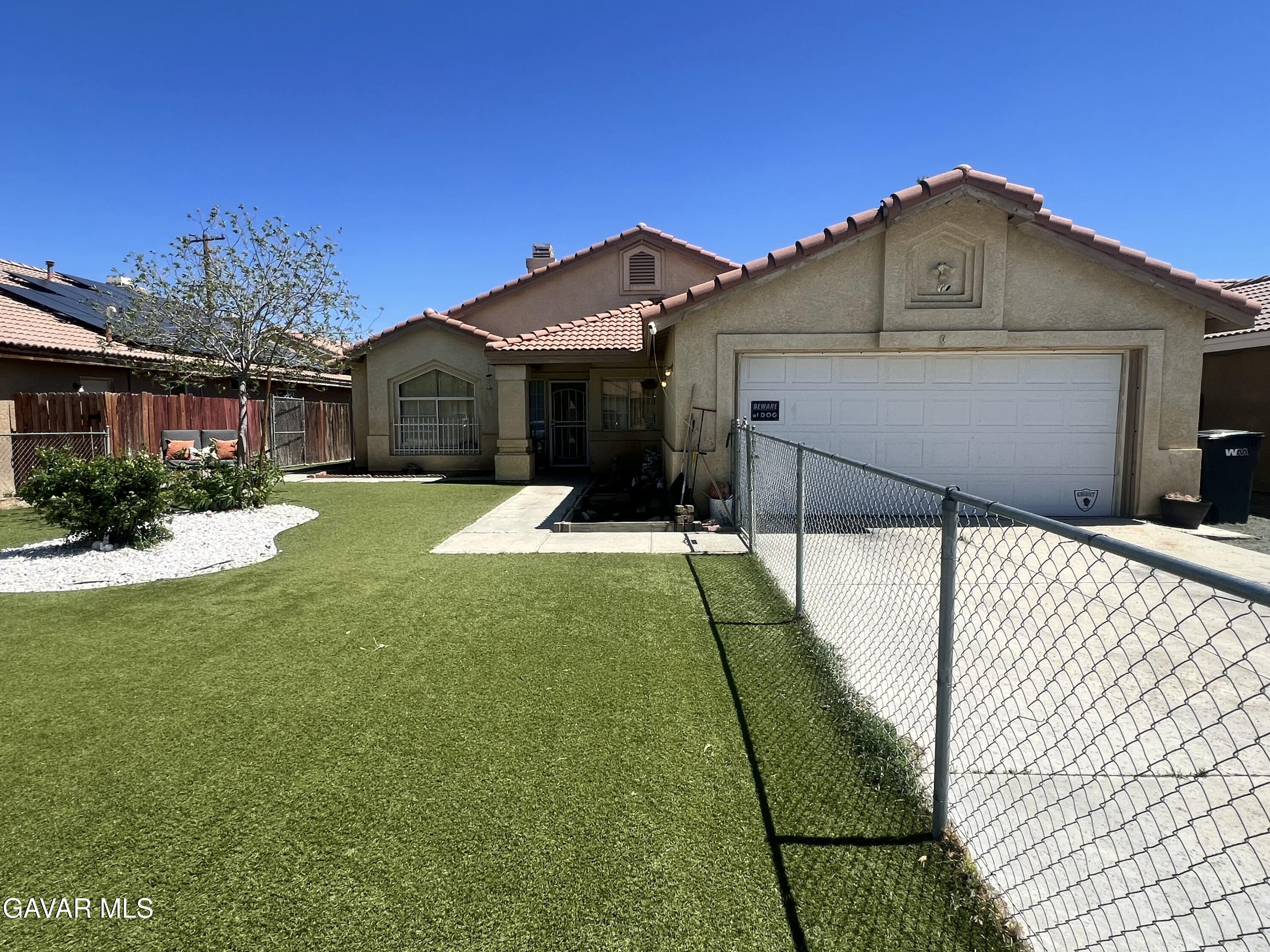 2428 Dixie Street Rosamond, CA 93560 - Photo 26 of 29 a view of a house with a yard