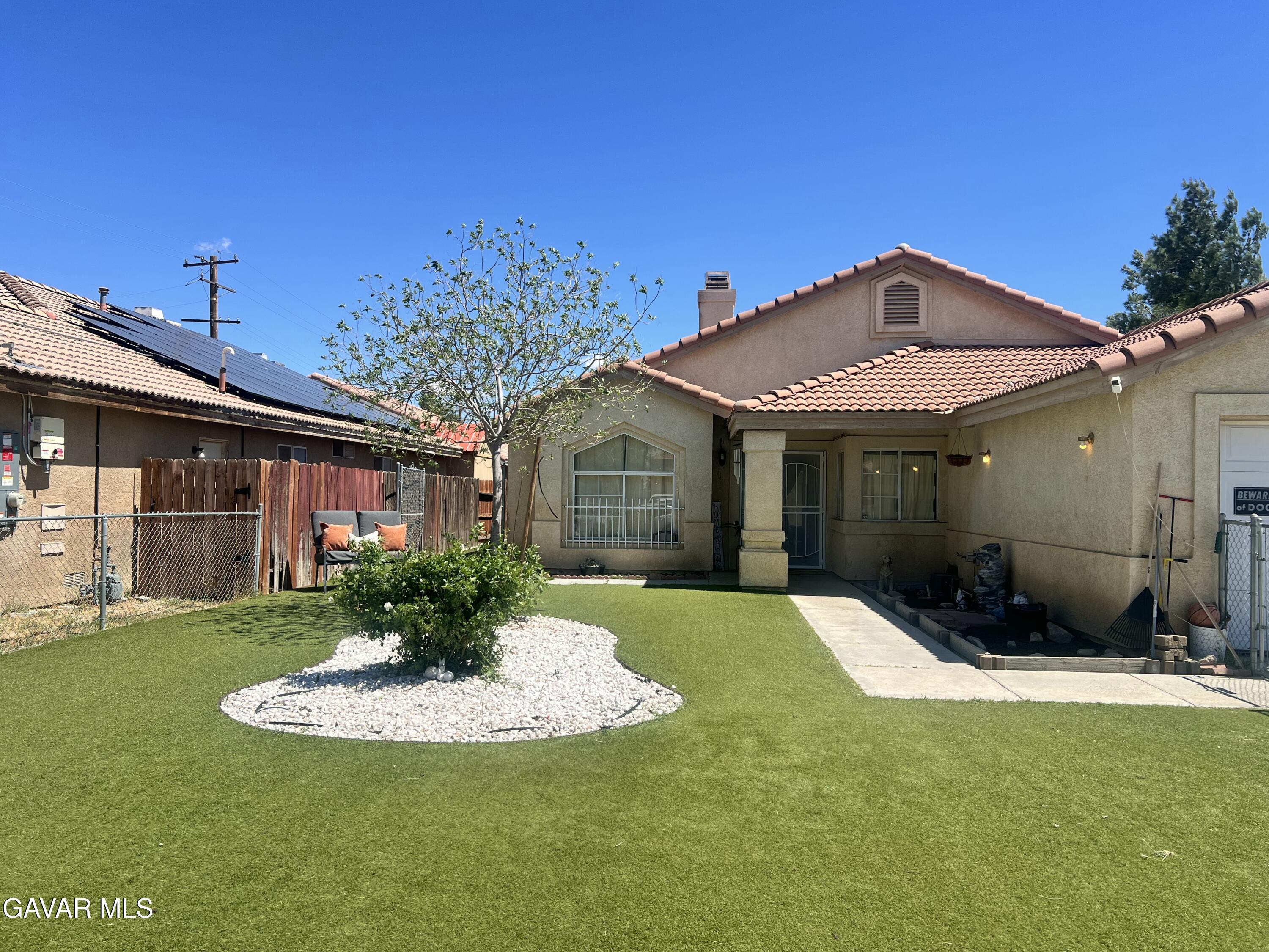 2428 Dixie Street Rosamond, CA 93560 - Photo 28 of 29 a front view of a house with a yard
