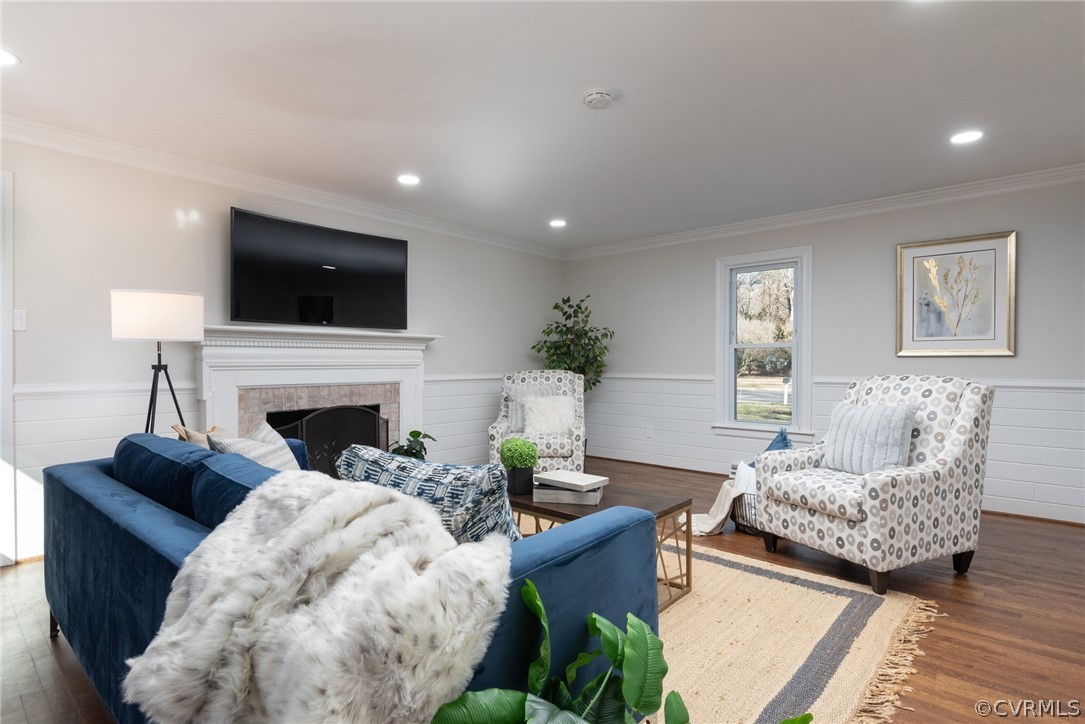 11711 Robious Road Midlothian, VA 23113 - Photo 11 of 32 a living room with furniture a fireplace and a flat screen tv