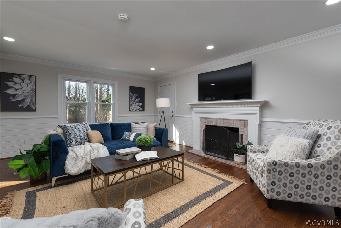 11711 Robious Road Midlothian, VA 23113 - Photo 12 of 32 a living room with furniture a flat screen tv and a fireplace