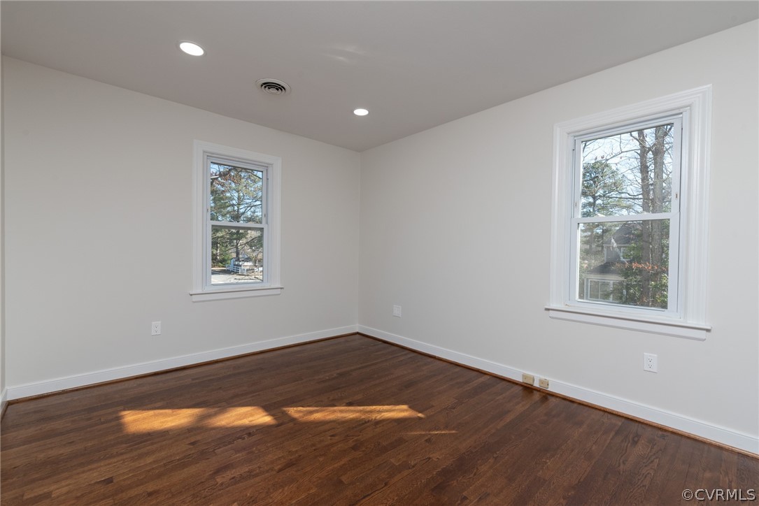 11711 Robious Road Midlothian, VA 23113 - Photo 14 of 32 an empty room with wooden floor and windows