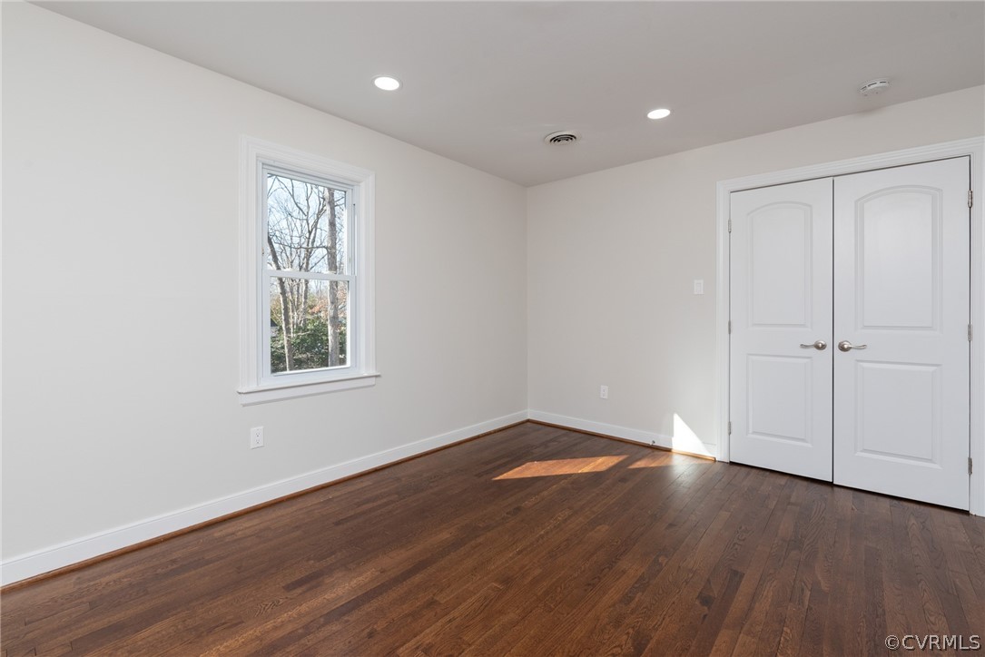11711 Robious Road Midlothian, VA 23113 - Photo 16 of 32 an empty room with wooden floor and windows
