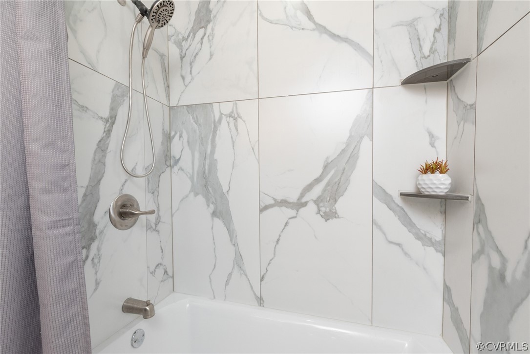 11711 Robious Road Midlothian, VA 23113 - Photo 17 of 32 a bathroom with a bathtub and shower