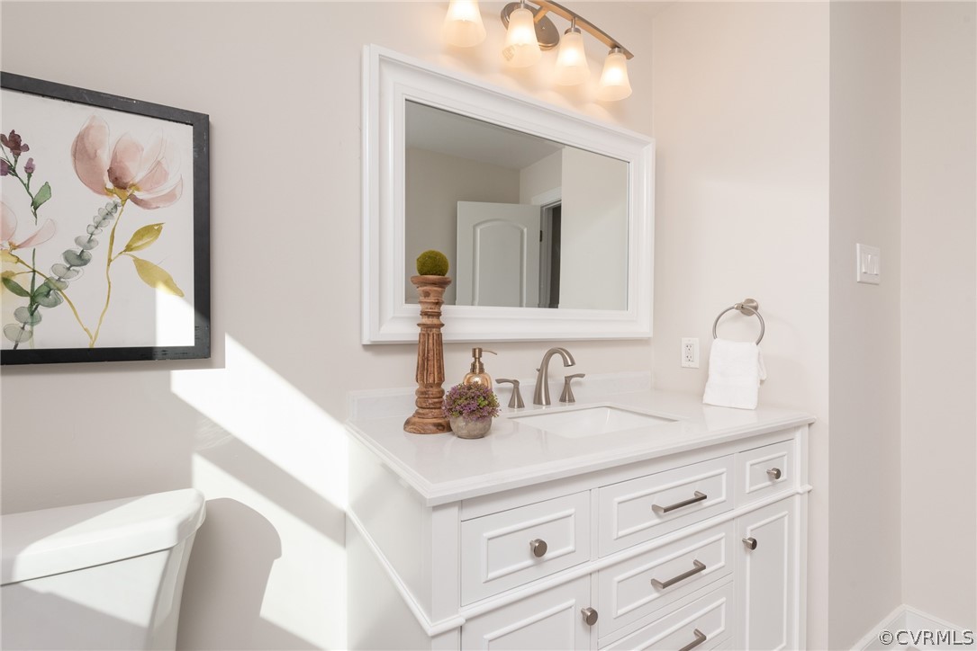 11711 Robious Road Midlothian, VA 23113 - Photo 18 of 32 a bathroom with a sink and a mirror