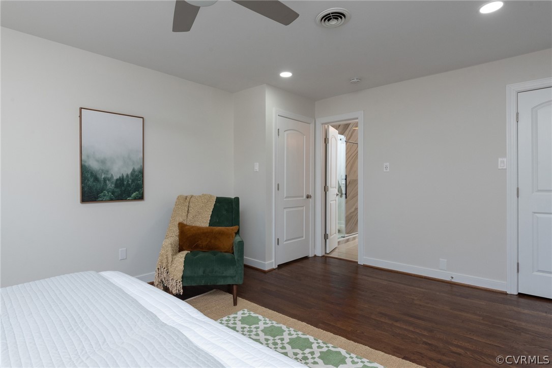 11711 Robious Road Midlothian, VA 23113 - Photo 20 of 32 a bedroom with a bed and wooden floor
