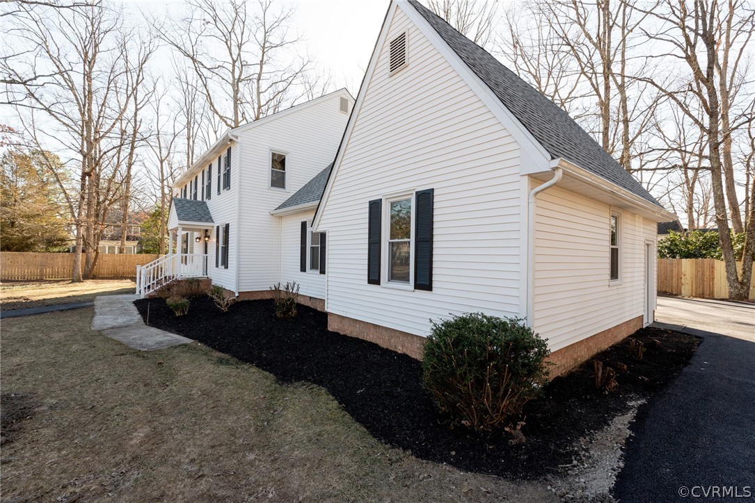 11711 Robious Road Midlothian, VA 23113 - Photo 2 of 32 a view of a house with backyard and trees