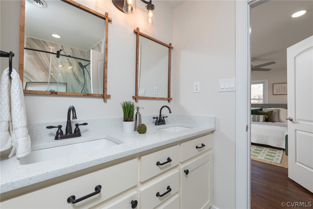 11711 Robious Road Midlothian, VA 23113 - Photo 23 of 32 a bathroom with double vanity sink and mirror