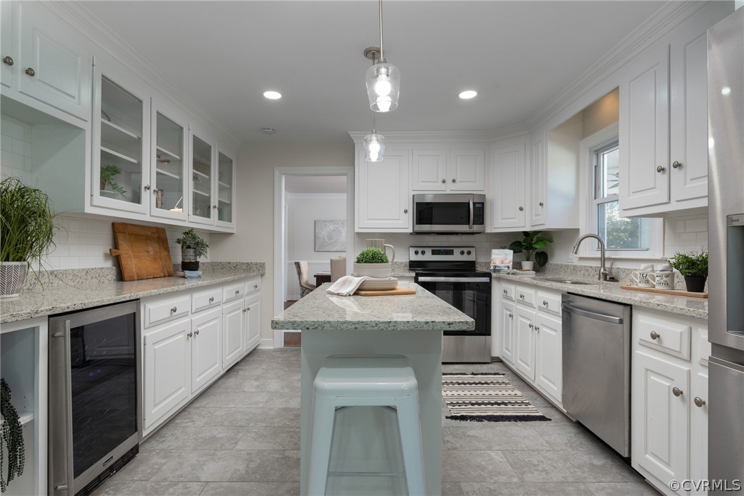 11711 Robious Road Midlothian, VA 23113 - Photo 7 of 32 a kitchen with granite countertop a stove sink and cabinets