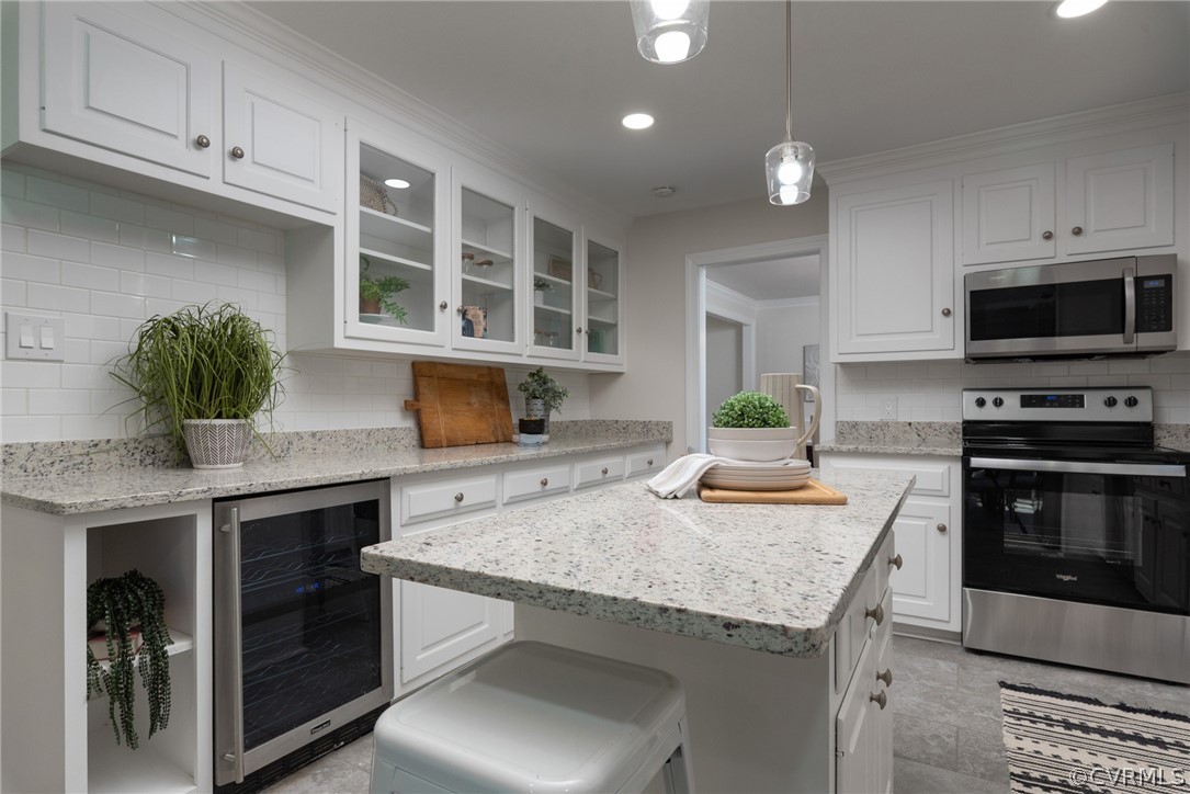 11711 Robious Road Midlothian, VA 23113 - Photo 8 of 32 a kitchen with a sink a stove and cabinets