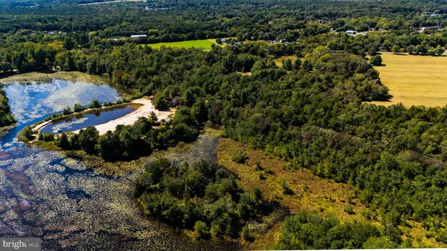 a view of a house with a yard and lake