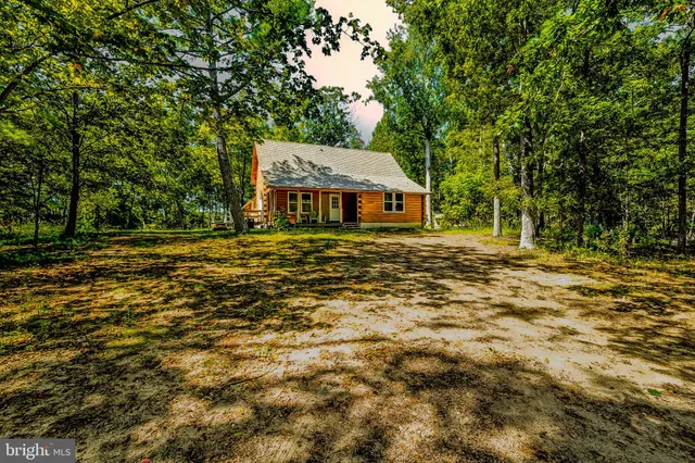a house with trees in the background