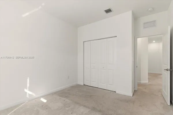 a bathroom with a sink toilet vanity mirror and shower