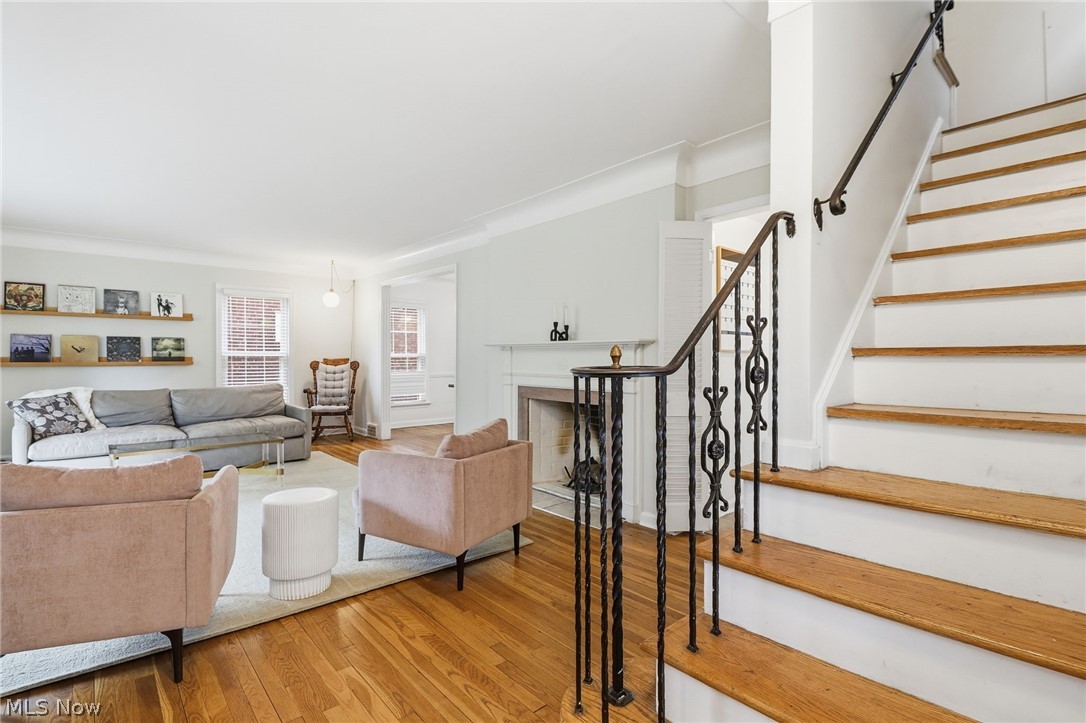 3713 Winchell Road Shaker Heights, OH 44122 - Photo 3 of 38 Hardwood flooring throughout the main level featuring a wrought iron staircase