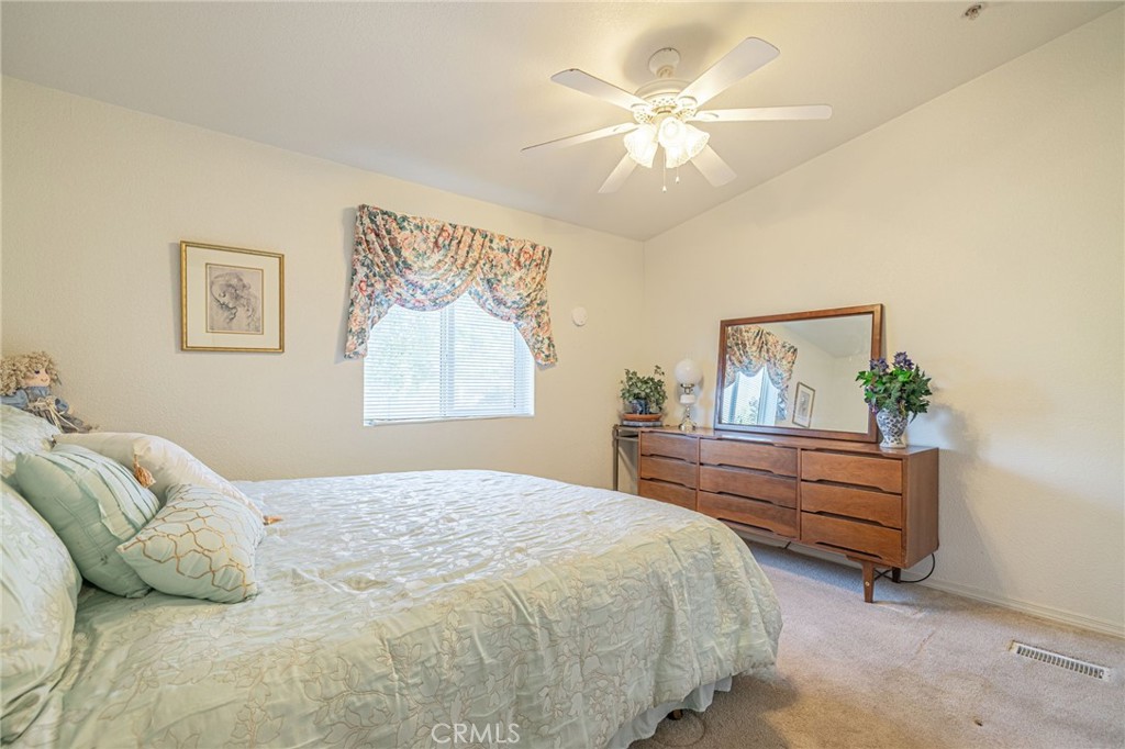 29520 Piani Road Pearblossom, CA 93553 - Photo 25 of 40 a bedroom with a bed and a painting on the wall