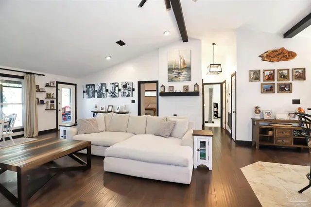 a living room with furniture and a table